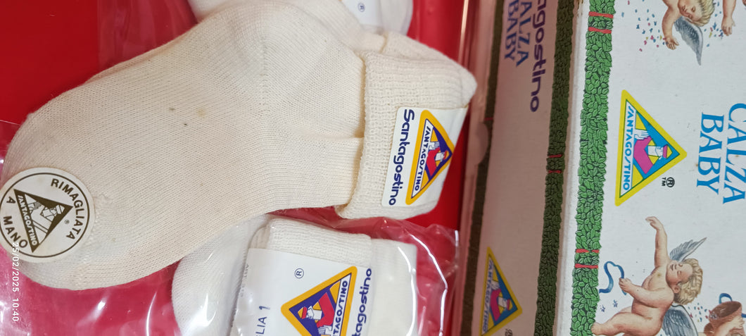 Nove paia di calzini baby bianchi, Santagostino, misura 0. 450 g.